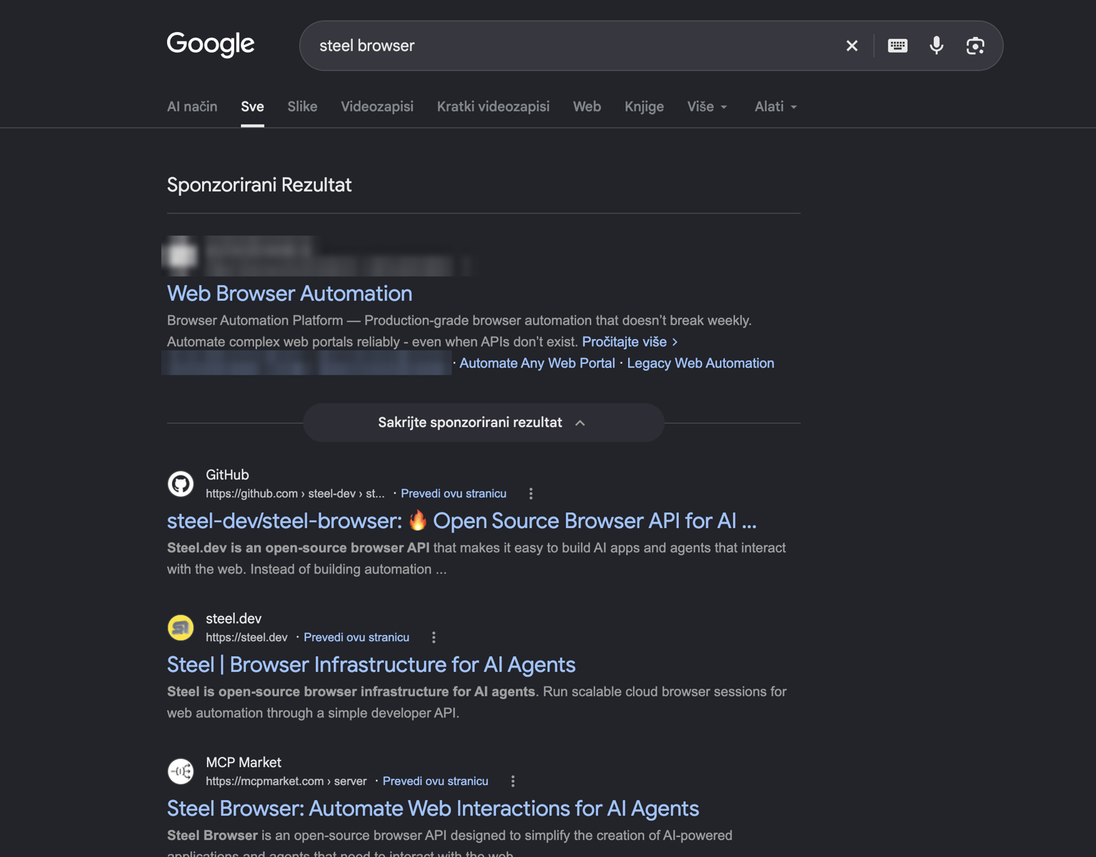 The same search from Serbia, with a different competitor ad above our results. Advertiser name is blurred.